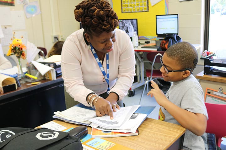 Rasheda Garcia, a teacher of the deaf and trained educational interpreter who serves students through the Educational Services Unit of the Burlington County Special Services School District, works one-on-one with a student.