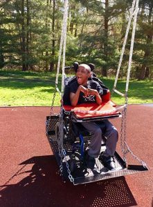 Child Laughing on a Wheelchair Swing