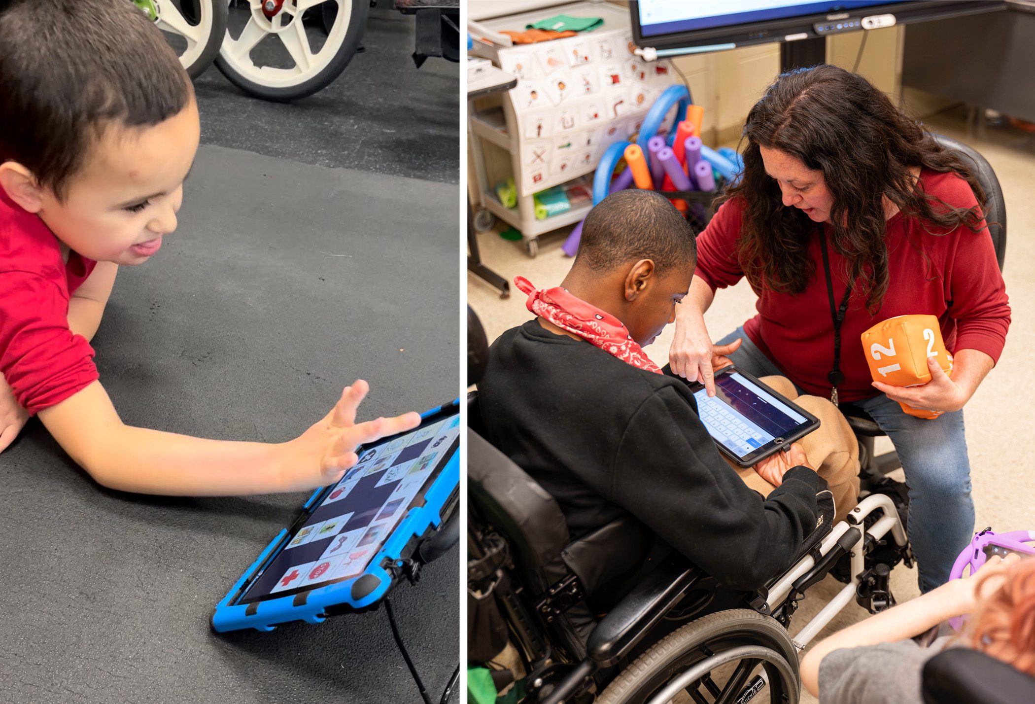 A smiling student is laying on his stomach using an AAC device to communicate. A student in a wheelchair is being assisted by his teacher to communicate by touching a button on an AAC device.